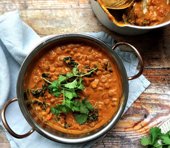 Creamy tomato and coconut dhal with cavolo nero